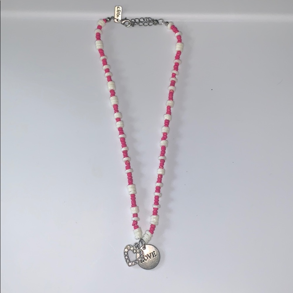A beaded necklace with 2 charms